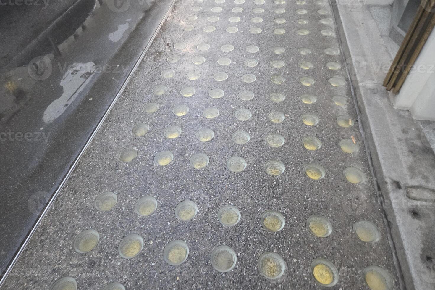 Urban Safety Design Featuring Tactile Paving for Accessibility and Pedestrian Guidance photo