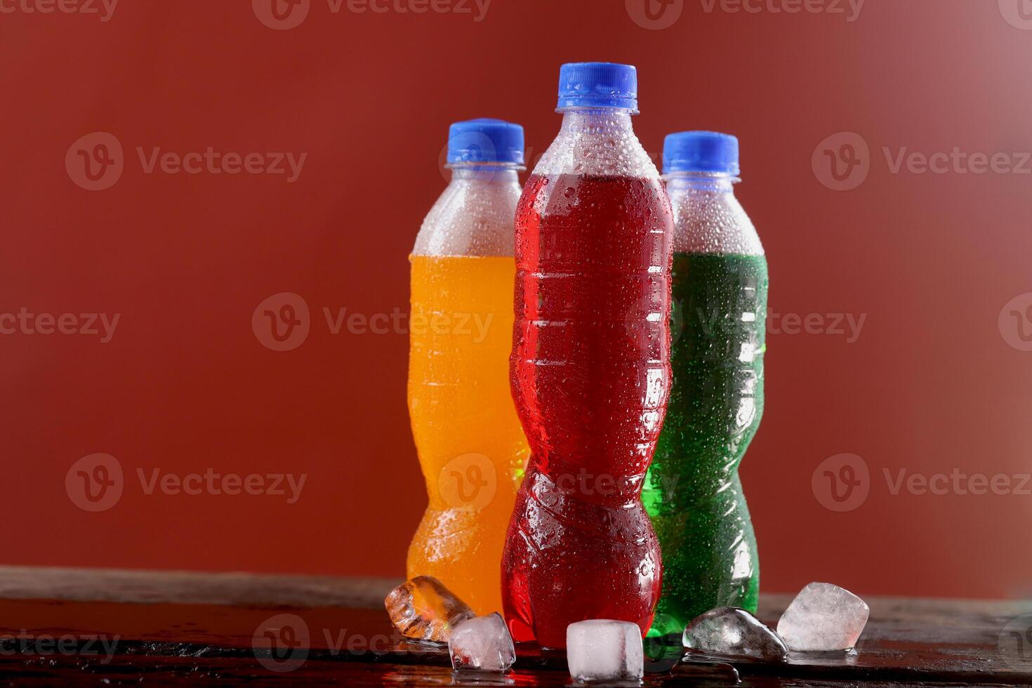 Soft drink bottle red background photo