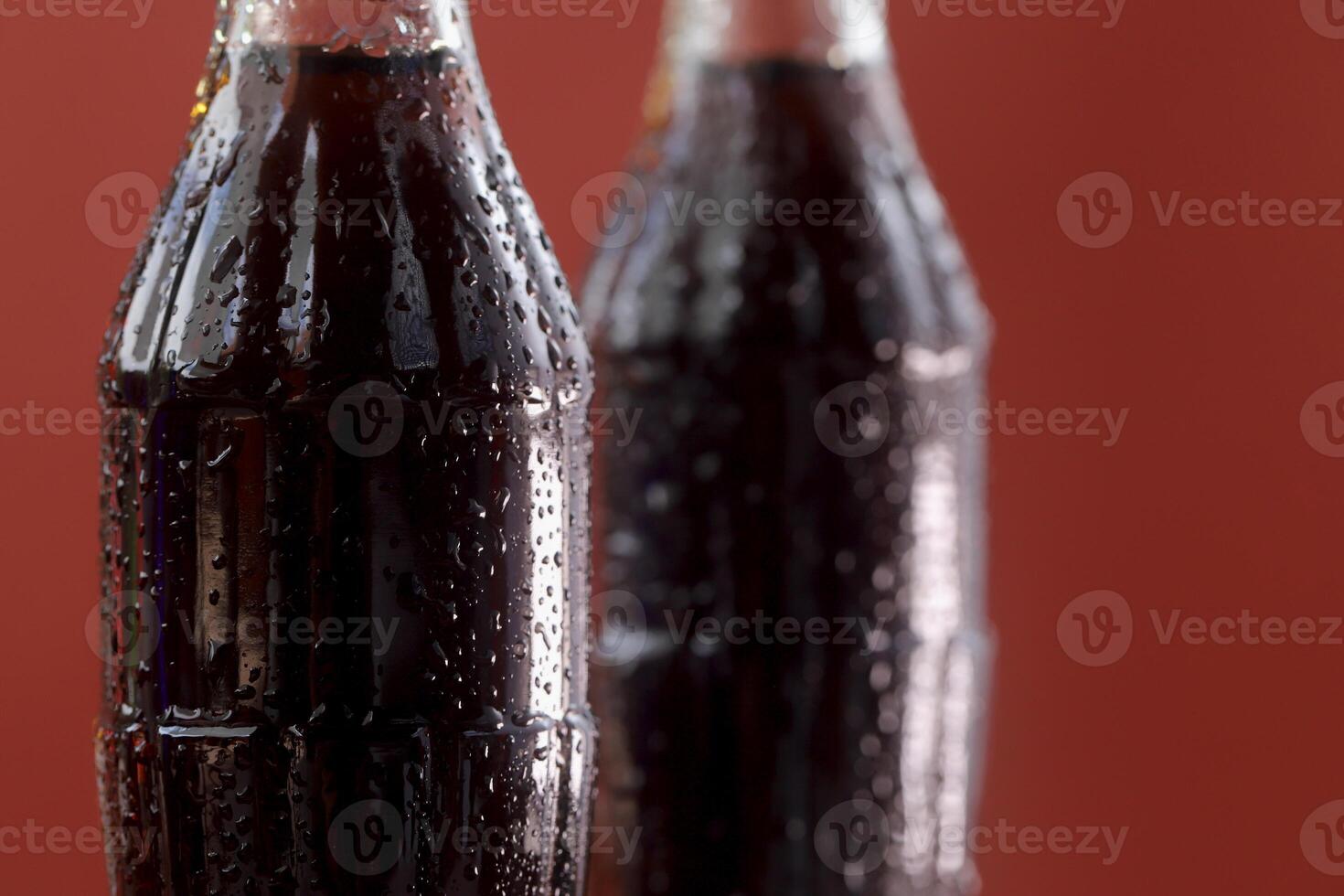 Soft drink bottle red a background photo
