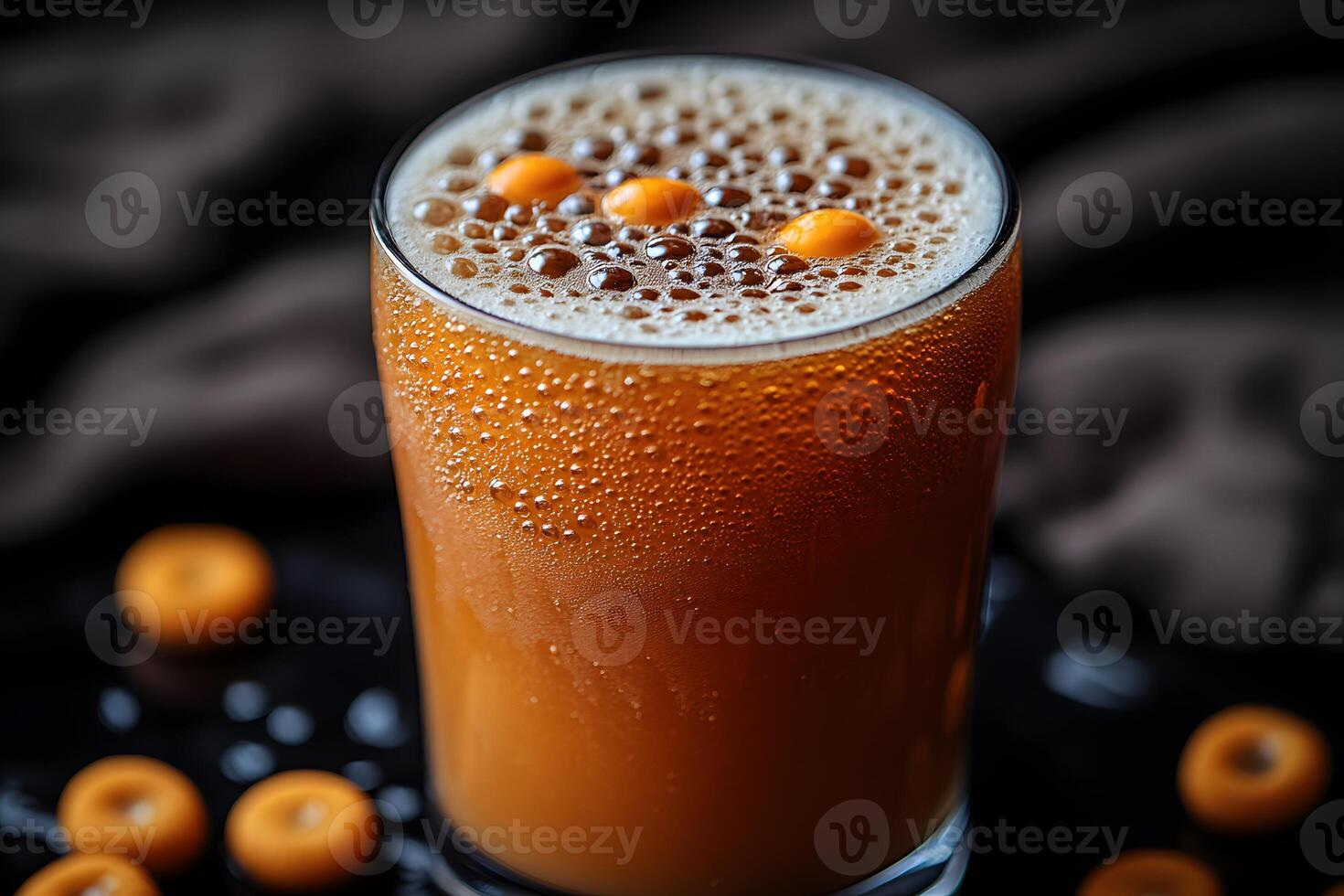 Refreshing Glass of Orange Bubbly Drink with Marbles for Party Decor photo
