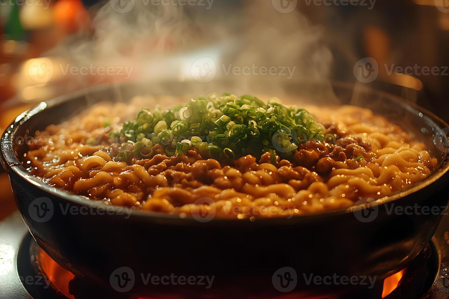 Steaming Hot Ramen with Green Onions in a Black Bowl - Culinary Delight for Food Lovers photo