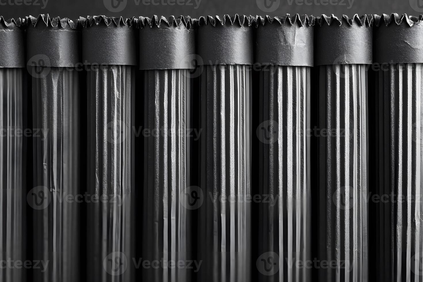 Monochrome Textures of Rolled Dark Paper Stacked in Vertical Formation for Creative Design photo