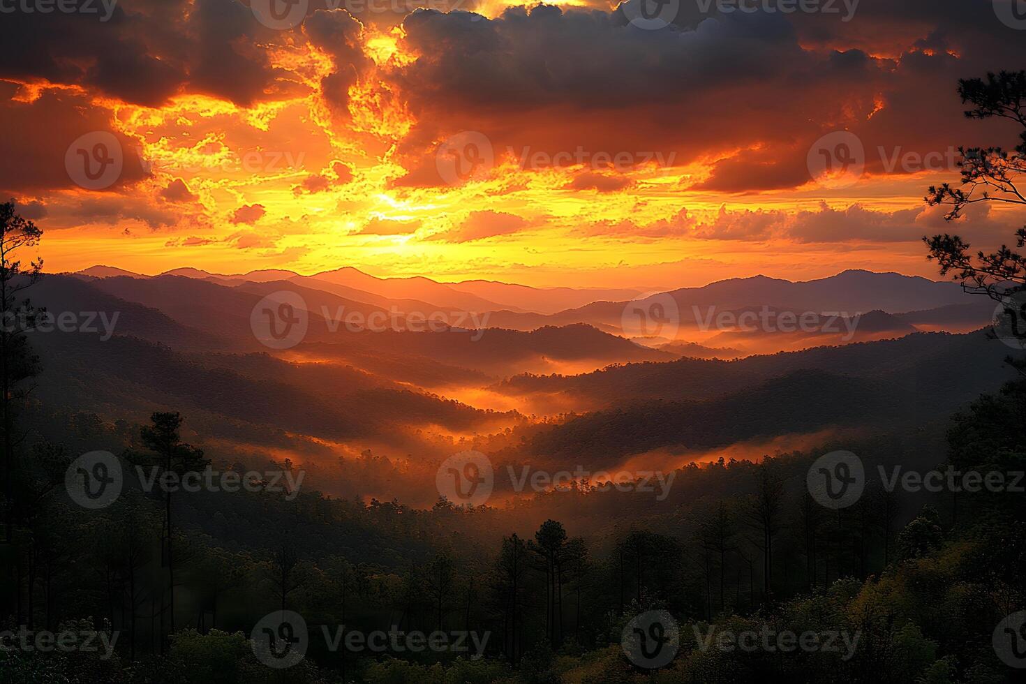 Mountain Sunrise with Dramatic Orange Sky and Misty Valleys in Scenic Landscape Photography photo