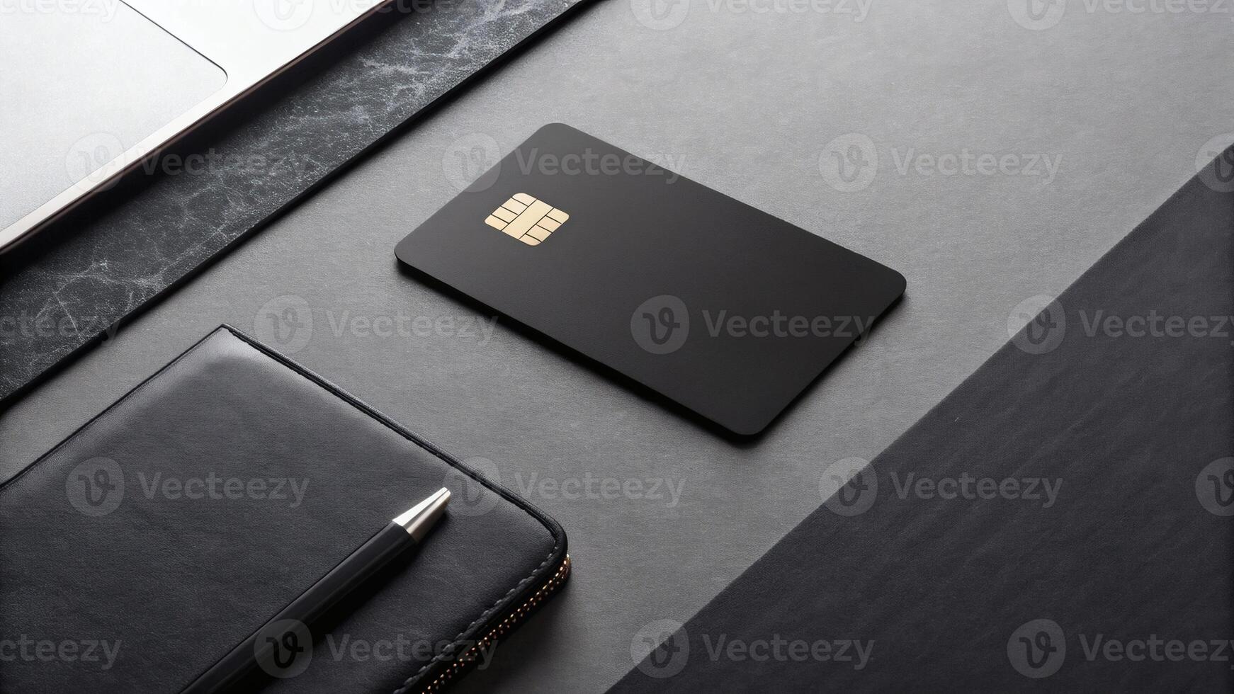 Black credit card on dark surface with copy space - minimalist financial photography for banking and payment service promotions photo