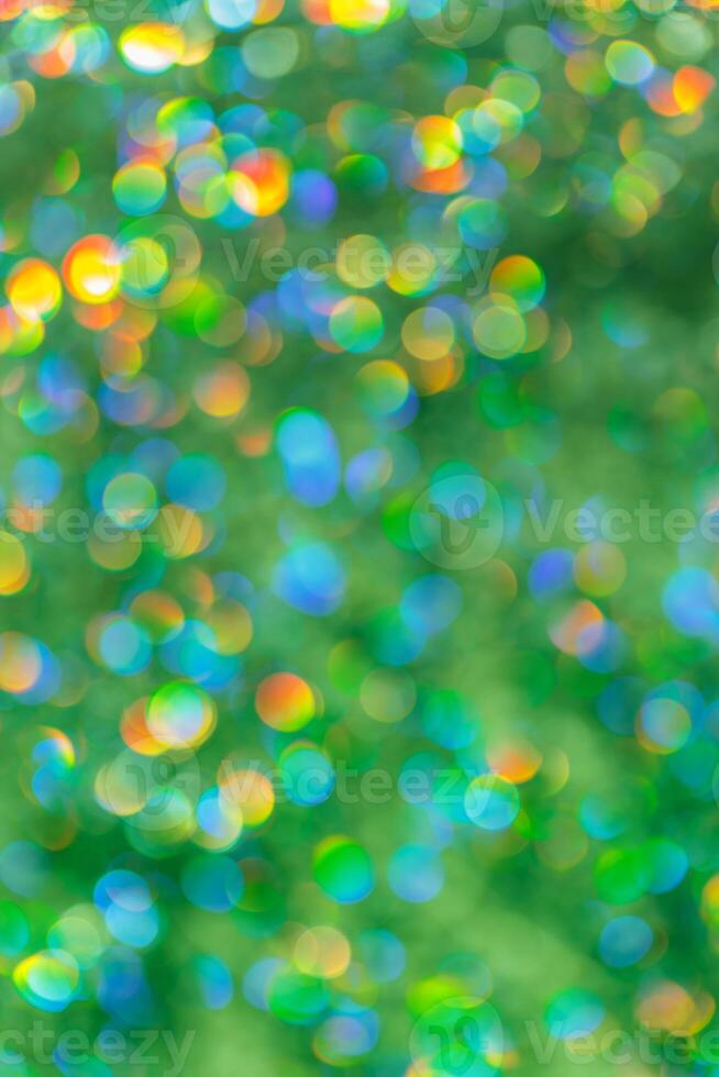 Green yellow Defocused abstract bokeh background pastel hues, flare from lights, color gradient, blurred round bokeh as holiday texture. Glittering aesthetic textured lighting photo