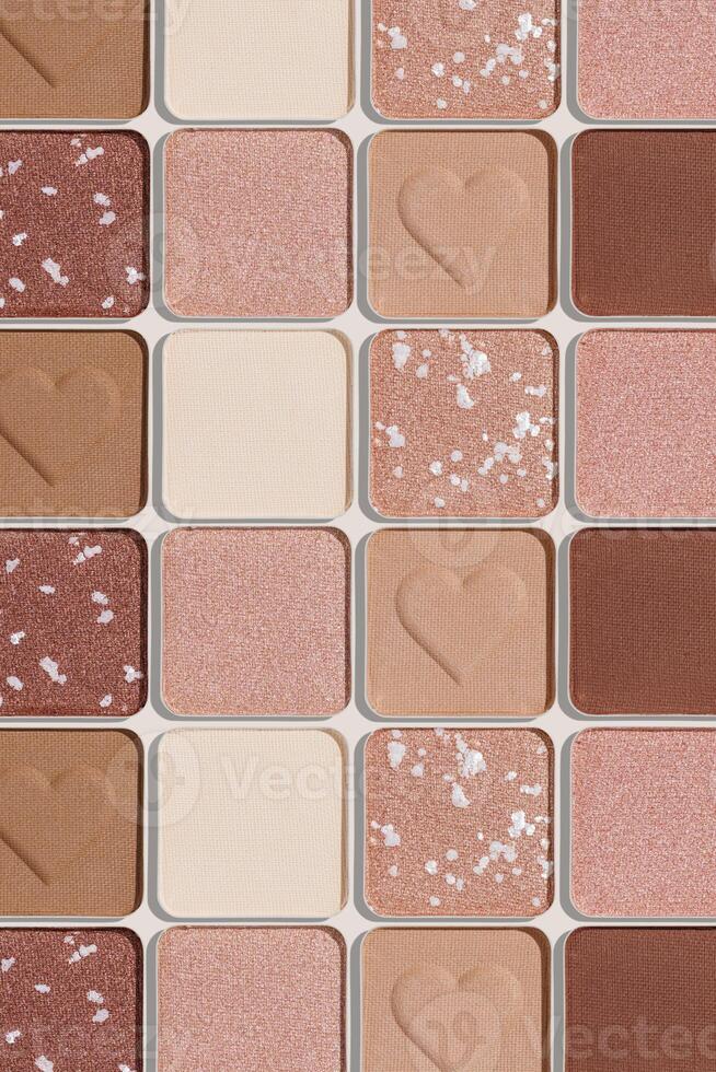 Minimal tren pattern of eye shadow beige tones swatches, monochrome photo background, eyeshadow with heart imprint, shiny natural shades powder makeup, square shape metal pack, beauty cosmetic texture