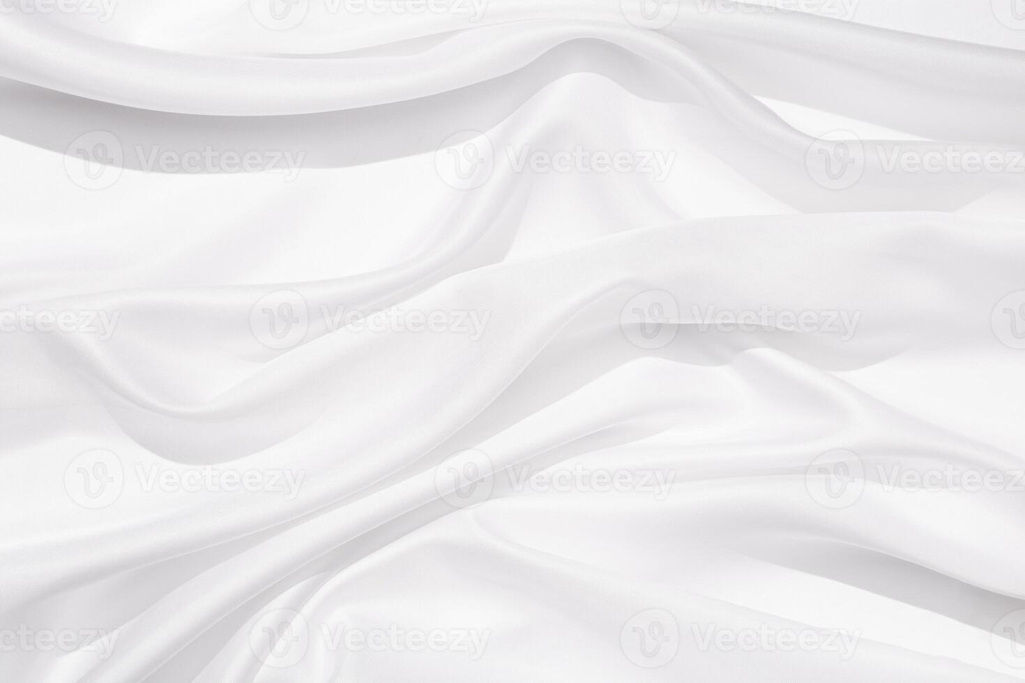 Textile linen tablecloth white colored with beautiful pleats. Cloth surface as background. photo