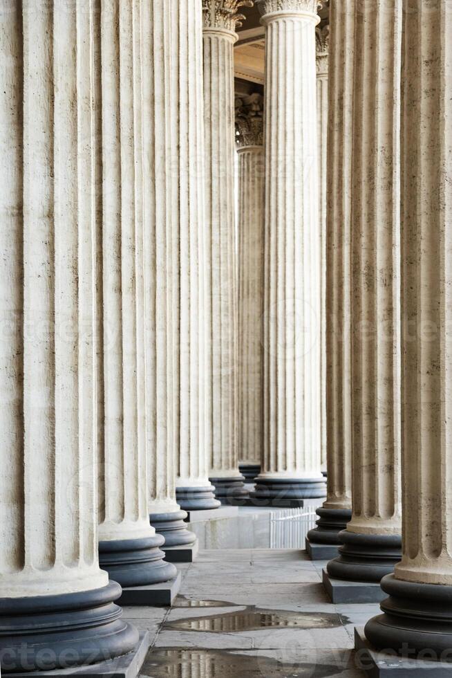 High marble columns as background, architectural design in style of classicism. Architectural pattern photo