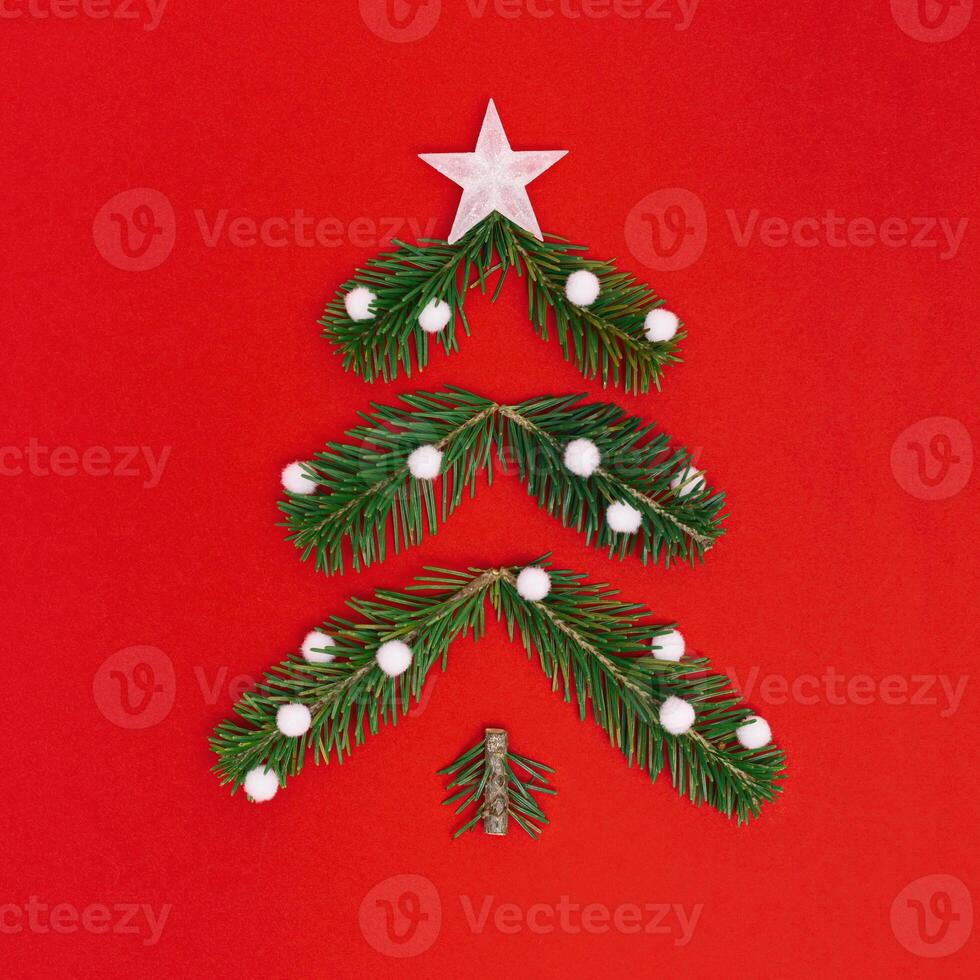 Creative Christmas pattern with green Christmas tree and snow, New Year composition. Minimal flat lay. photo