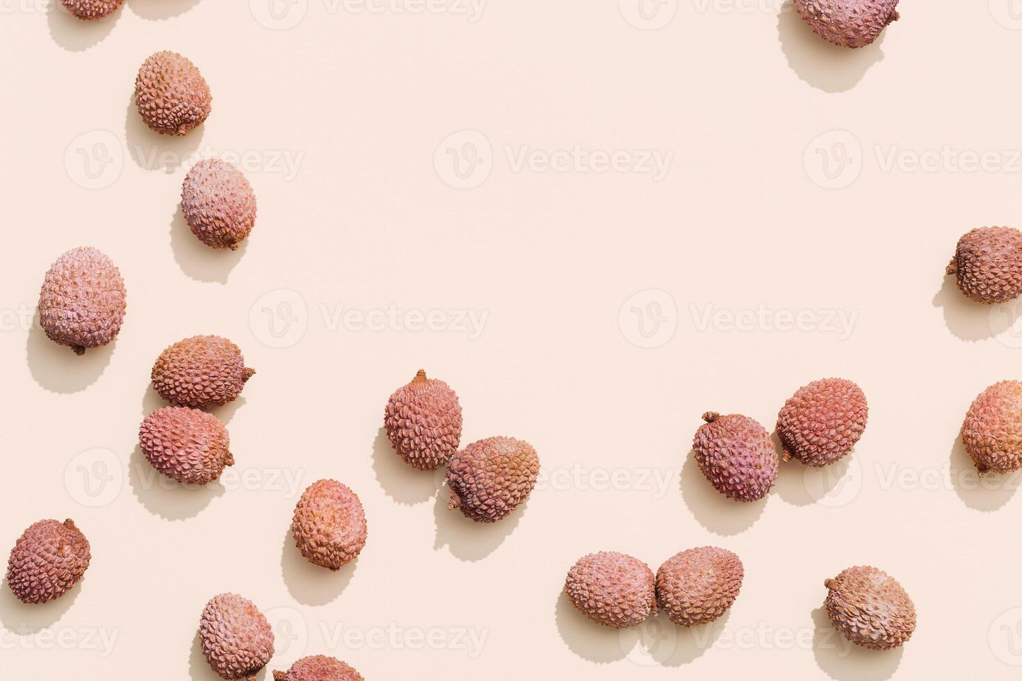 Fresh Lychee fruit on pastel beige background. Minimal fruit and summer concept. photo