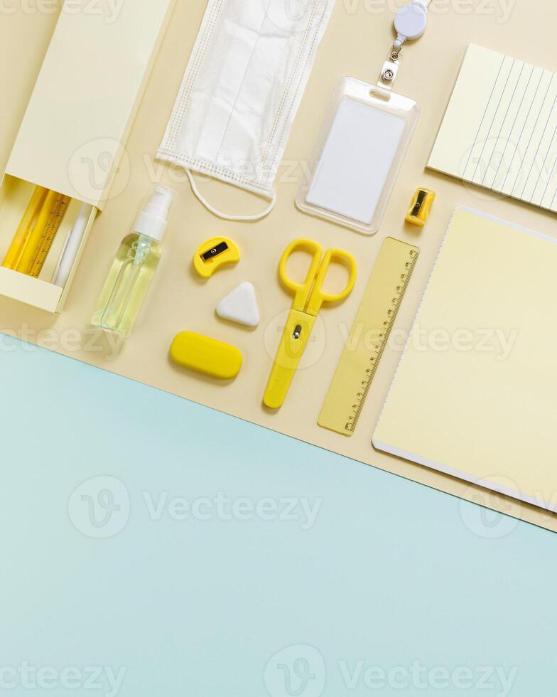 New normal concept workspace desk school Geometric pattern with office supplies and ppe photo