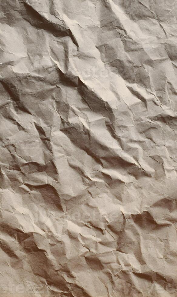 Close up view of a beige crumpled paper texture showing all the creases and wrinkles for background use photo