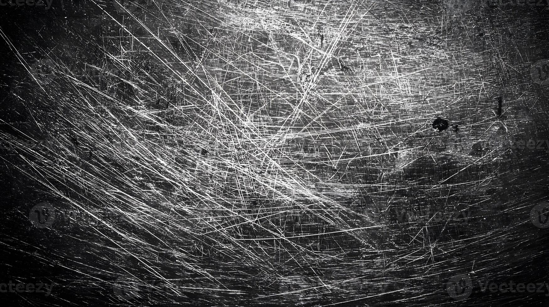 Intricate textures and patterns of scratched metal surface create an abstract and industrial feel photo