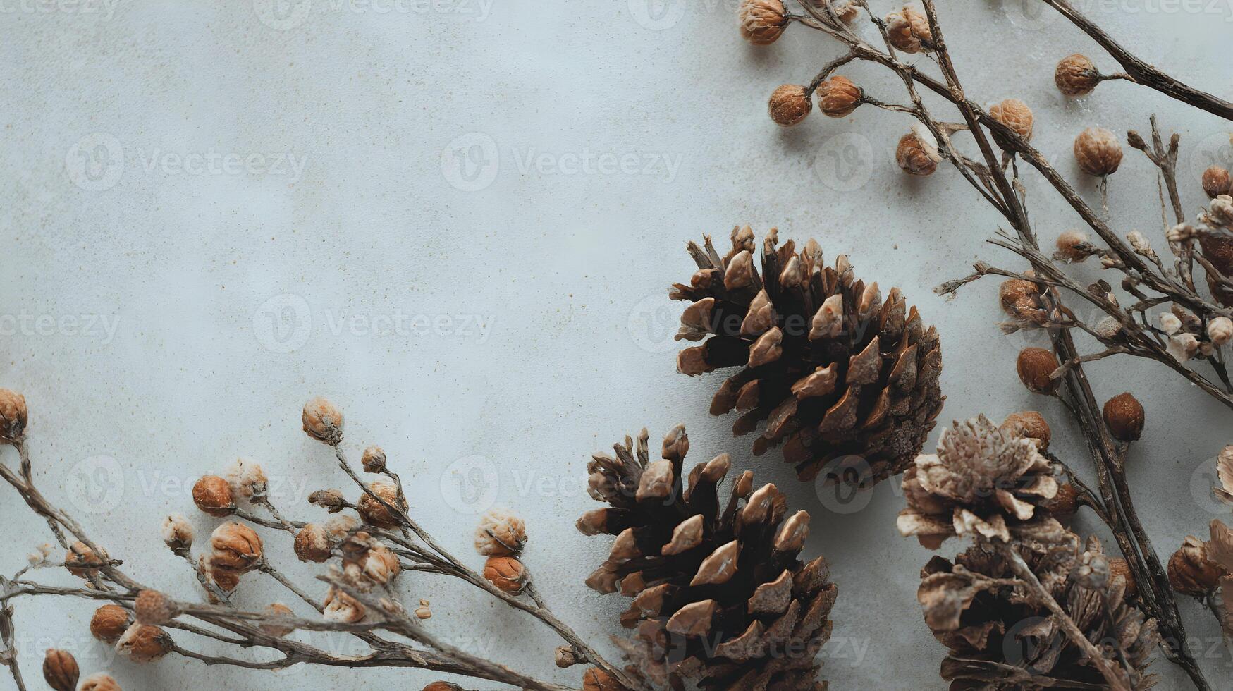 Aesthetic autumn arrangement featuring pine cones and delicate branches against a light background photo