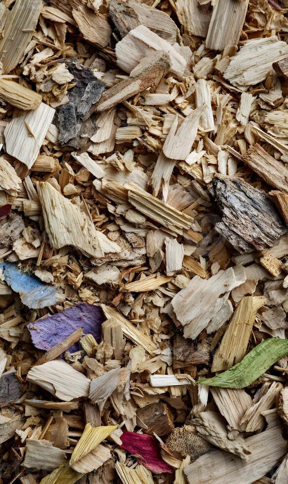 An array of wood chips and shavings create a naturally textured and organic background perfect for designs and presentations photo