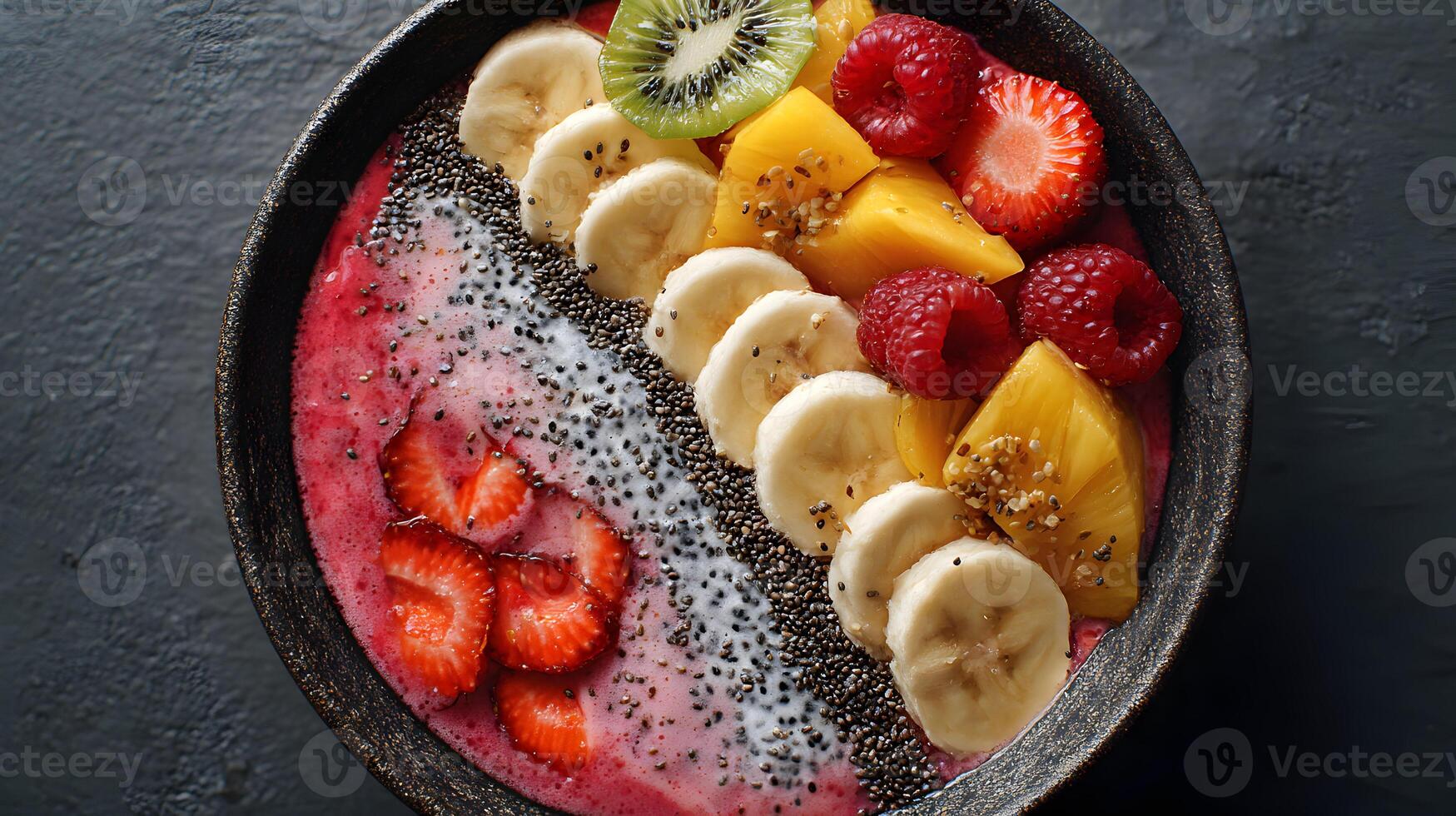 Delicious and vibrant fruit smoothie bowl topped with fresh strawberries bananas raspberries and kiwi fruit photo