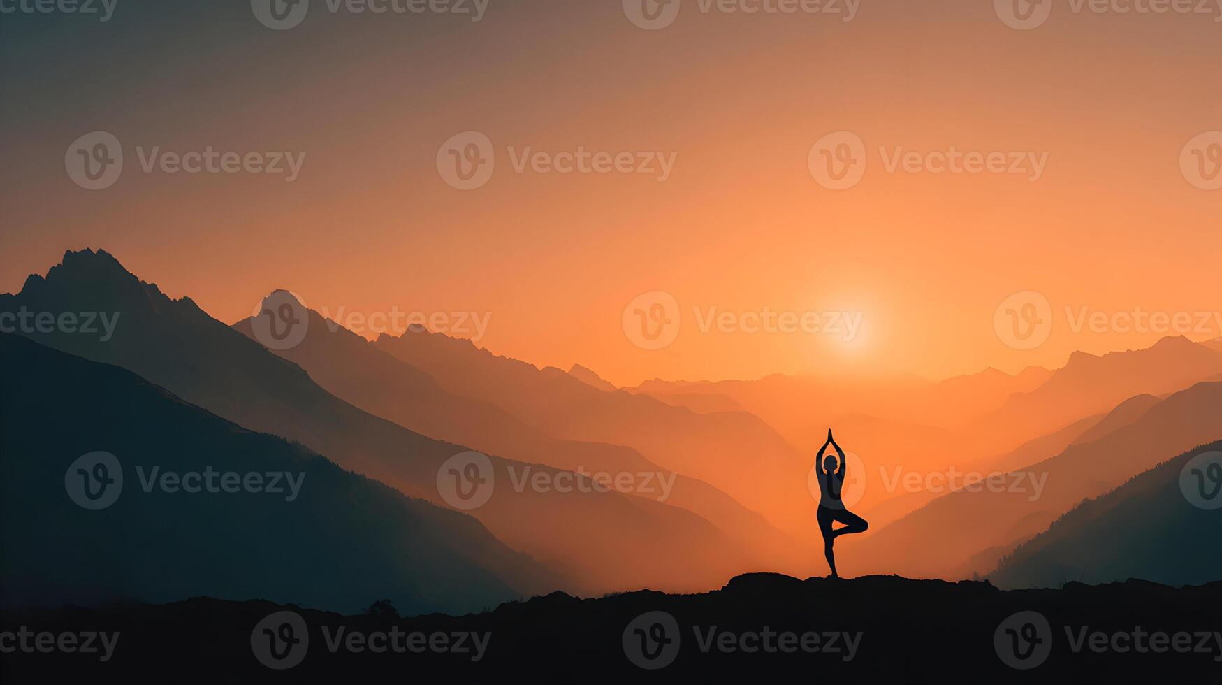 Silhouette of a serene woman practicing yoga in a mountainous landscape at a beautiful sunset light photo