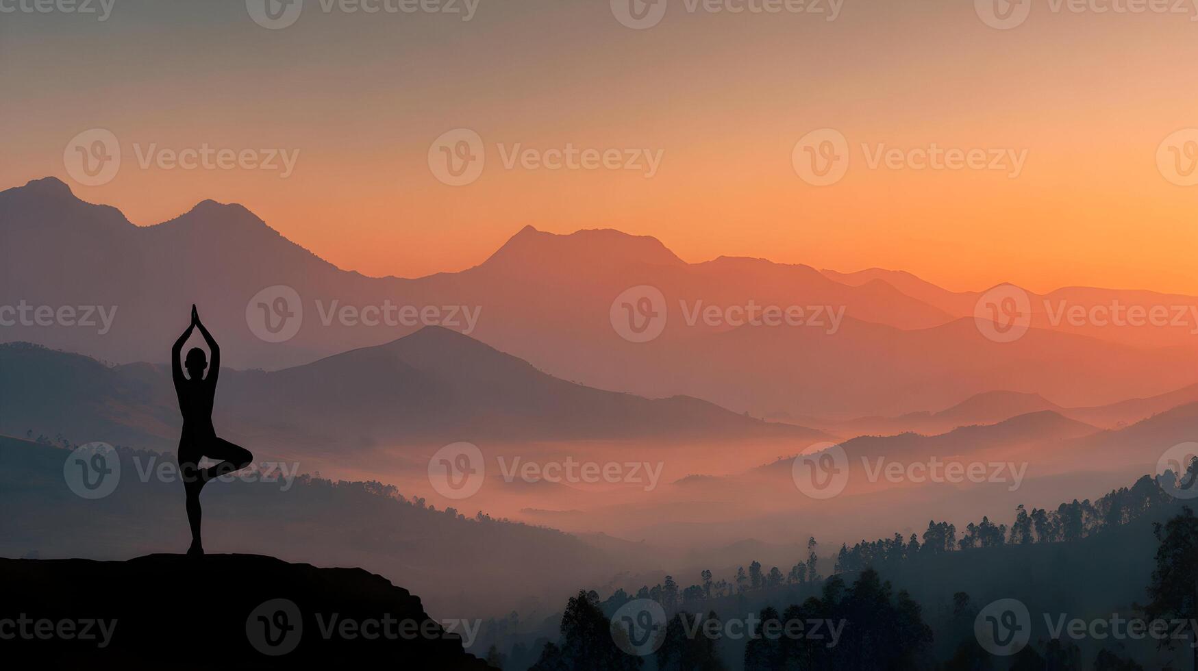 Silhouette of woman in tree pose yoga with mountain range and sunrise in the distance serenity photo