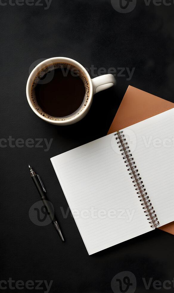 Elevated morning routine featuring aromatic coffee alongside an open notepad on a sleek black surface inviting focus and inspiration for the day ahead photo