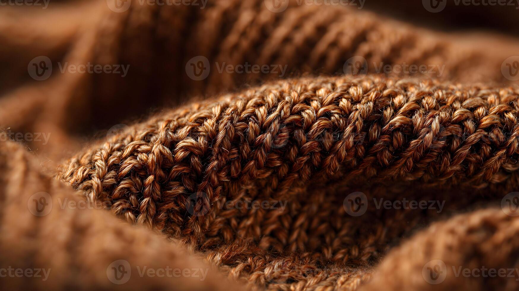 Detailed macro photograph showcasing the intricate texture of a cozy brown knitted wool fabric surface photo