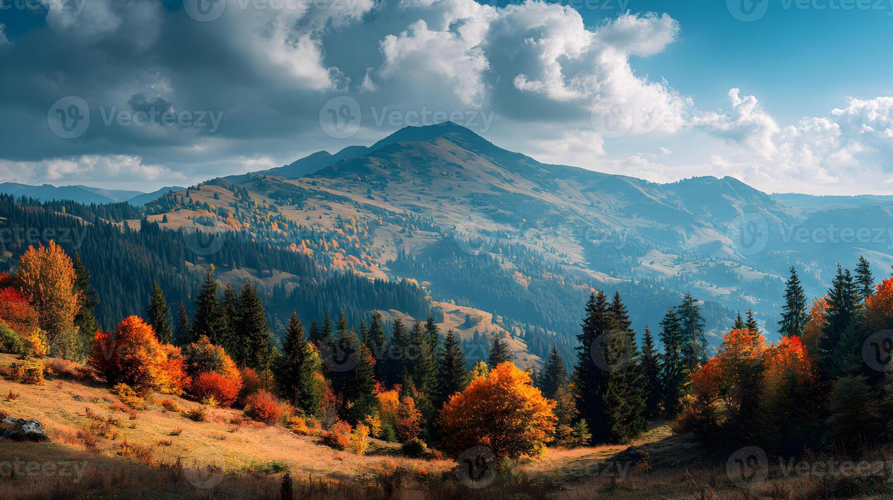 Majestic mountain landscape with autumn colored trees and a scenic sky under a cloudy weather day photo