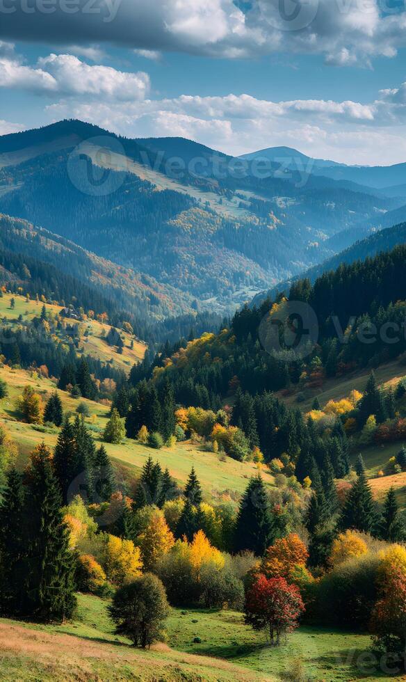 Majestic mountains enveloped in autumn colors serene landscape under a blue sky with fluffy clouds evokes tranquility peaceful scenery photo