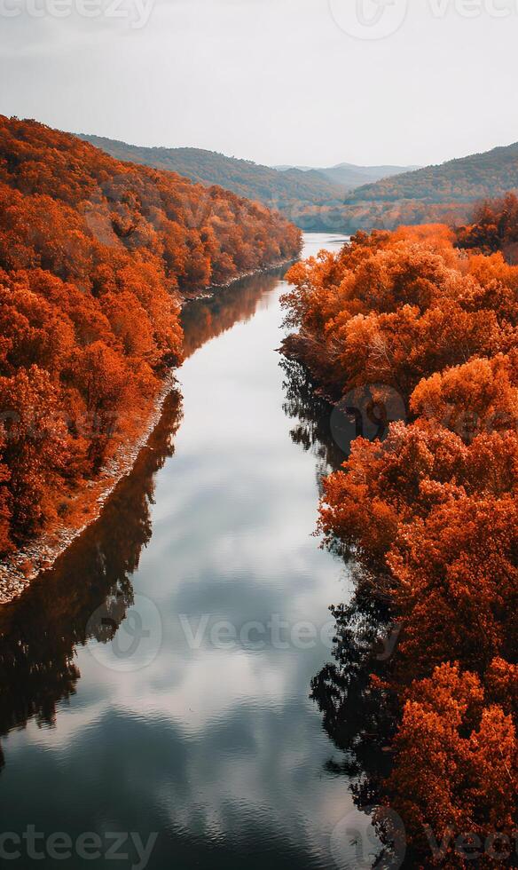 Autumn serenity a tranquil river reflecting cloudy skies amid vibrant fall foliage beauty and nature abound photo