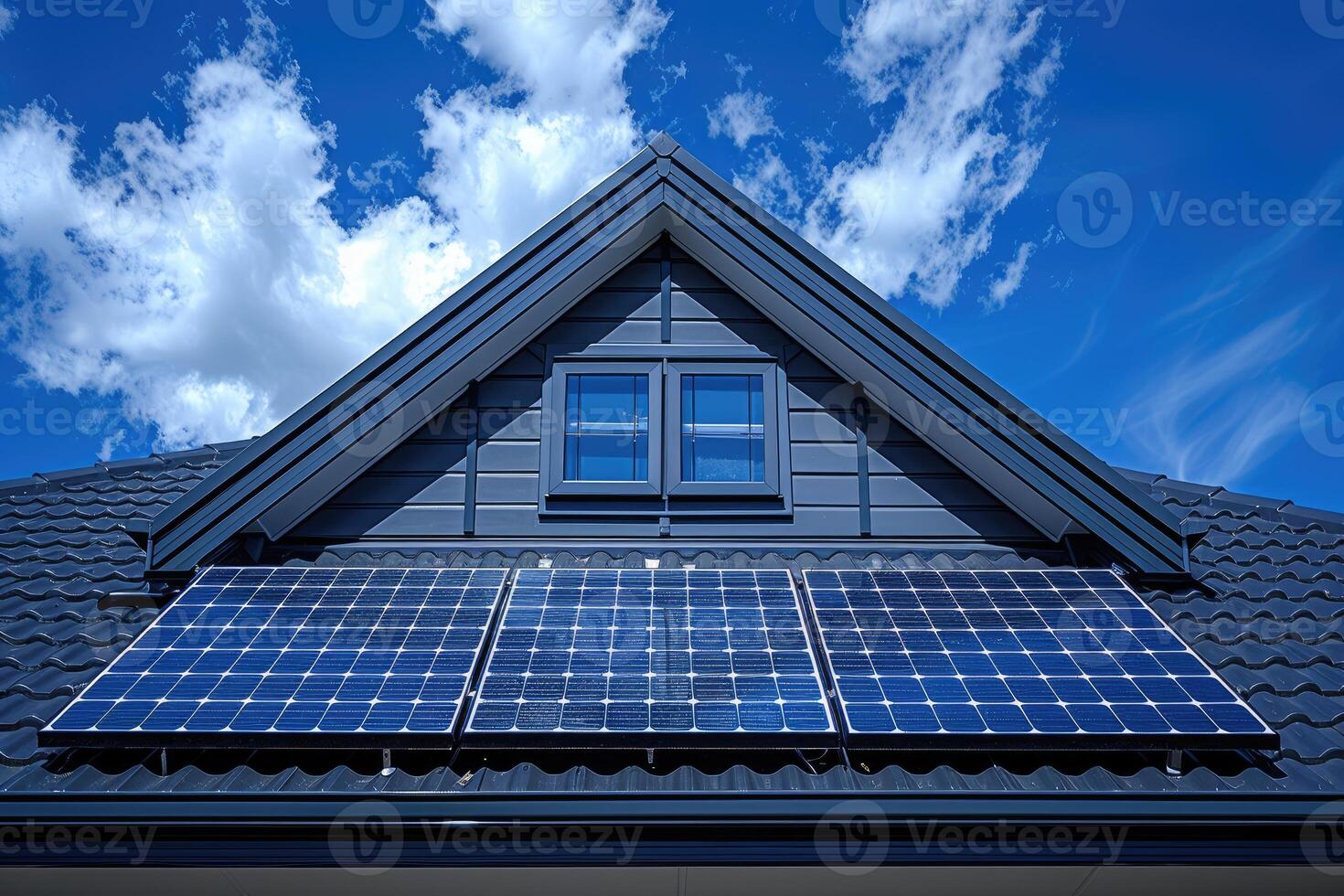 Solar Panels Installed on a House Roof Under a Blue Sky photo
