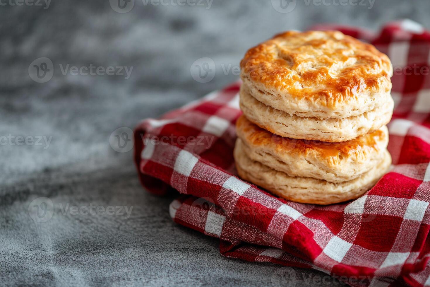 Biscuits on a red and white checkered cloth photo