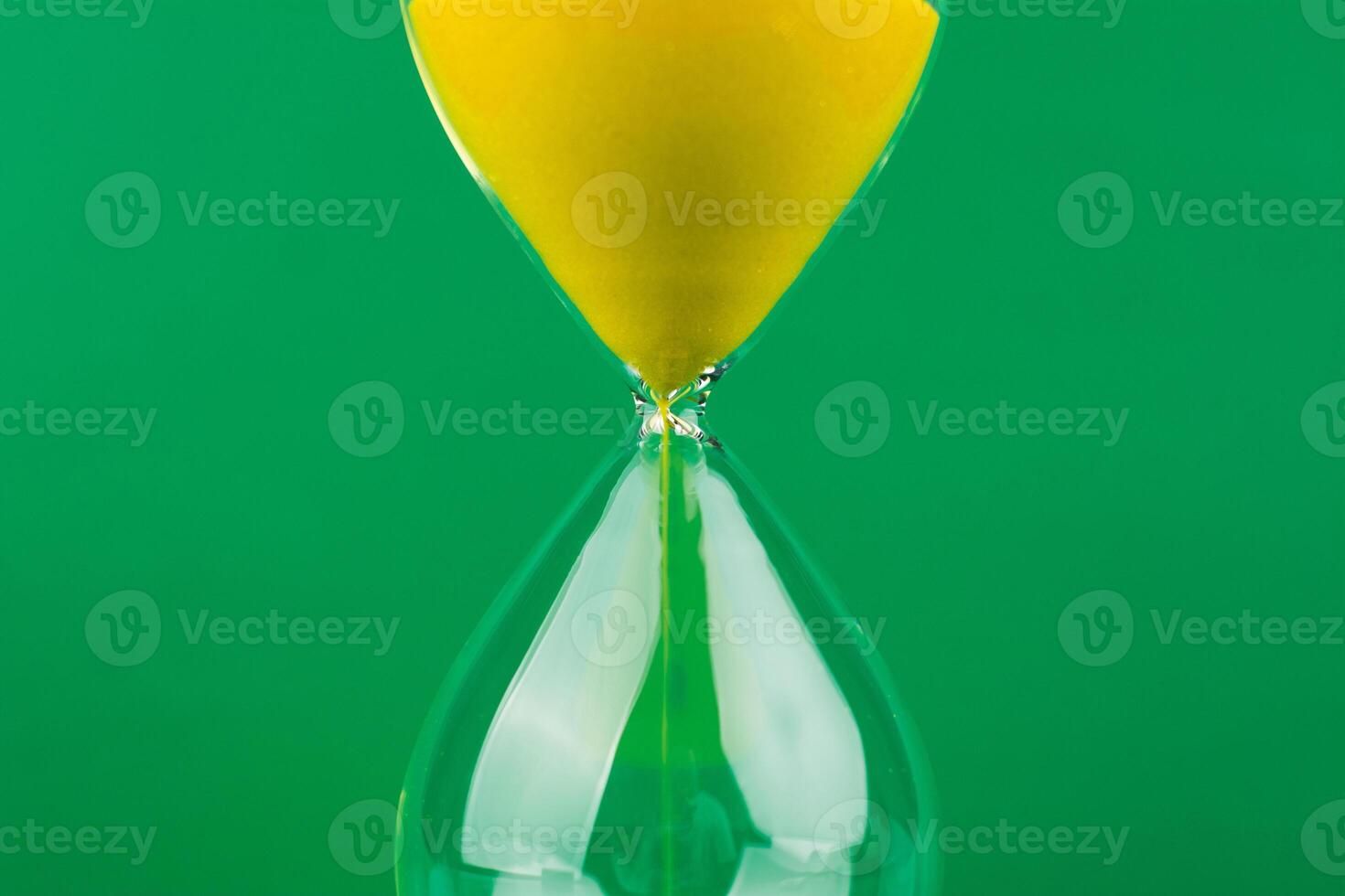Hourglass The process of time running out The rule of limited time photo