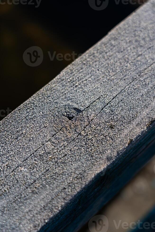 Frost on wooden railings fences. Frost Macro Diagonal lines photo