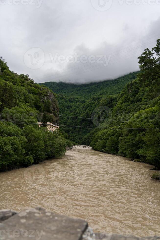 Chorukh River in Georgia View from the bridge to the river between the mountains photo