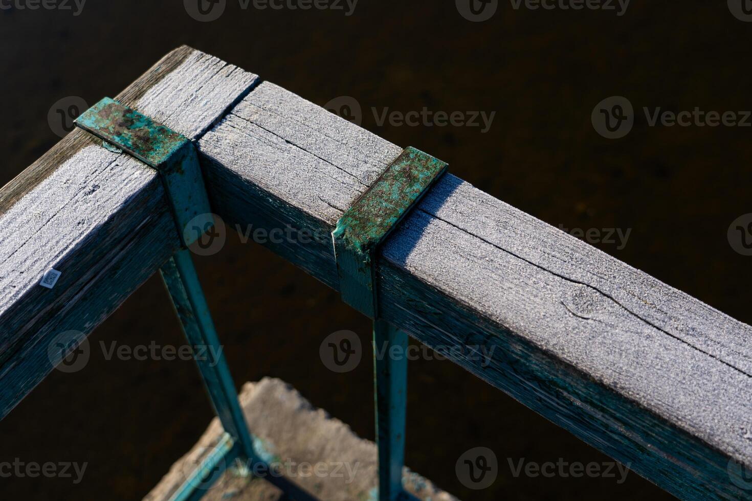 Frost on wooden railings, fences. Frost. Macro Diagonal lines photo