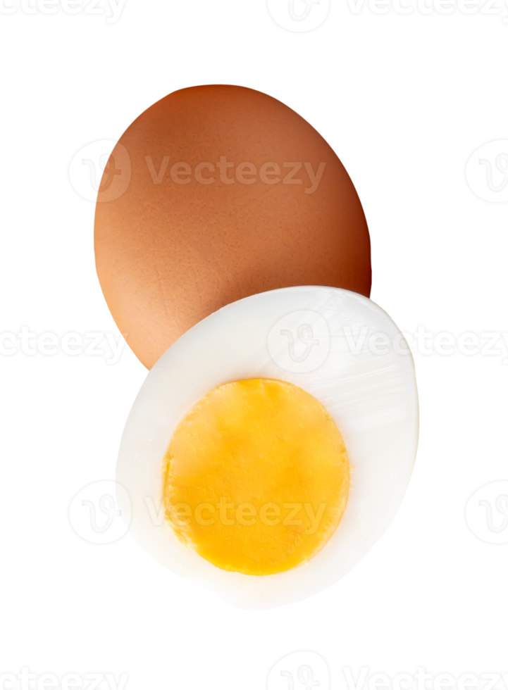 One raw chicken egg and cooked or boiled chicken egg with egg yolk in half in small pile isolated with clipping path in file format png