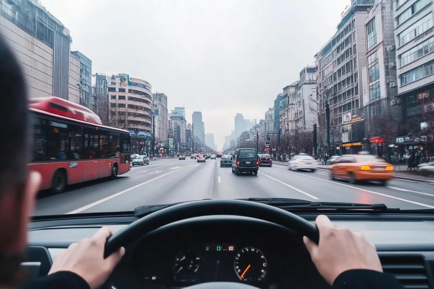 A man driving a car on a busy city street photo