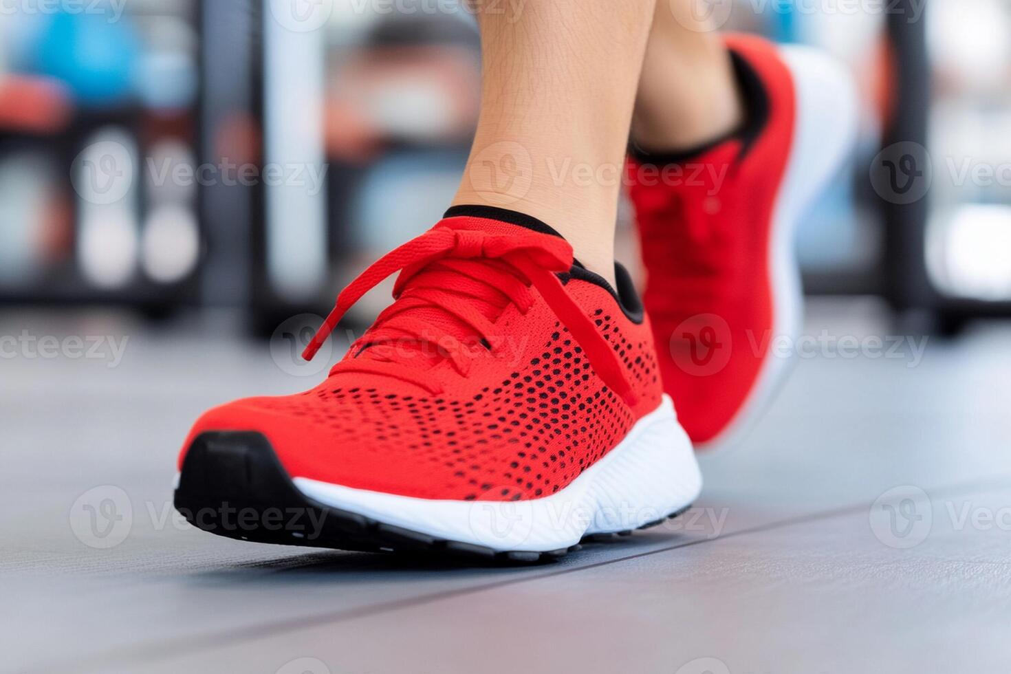 Close up of woman's feet in red running shoes photo
