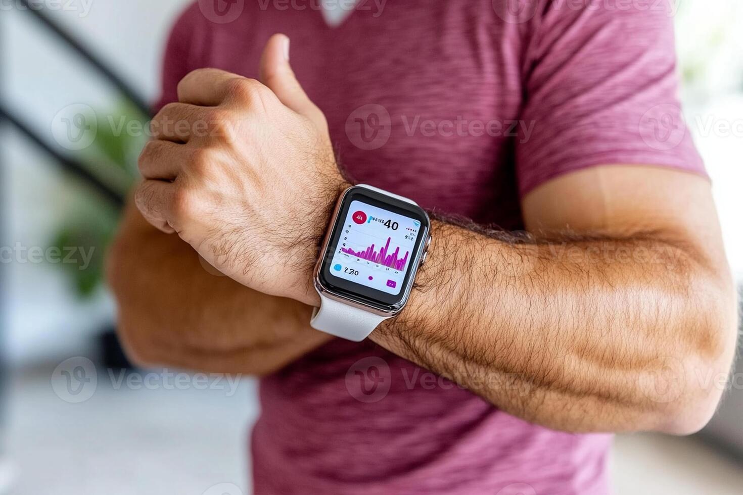 A man is showing off his fitness tracker on his wrist photo