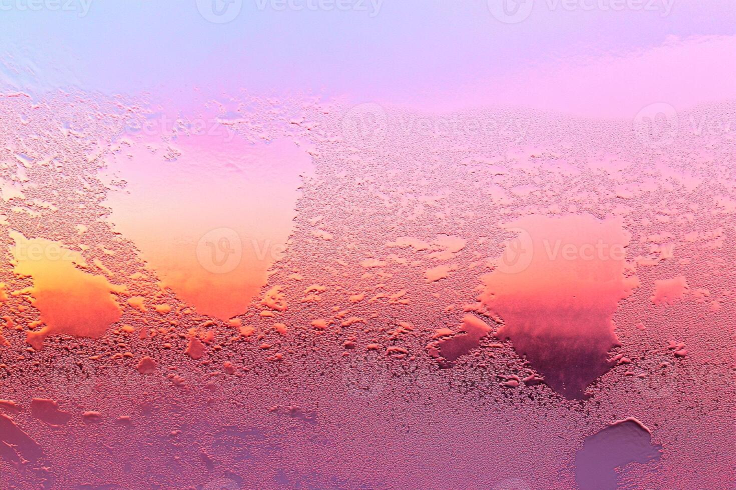 A frosted window with a pink and blue sky photo