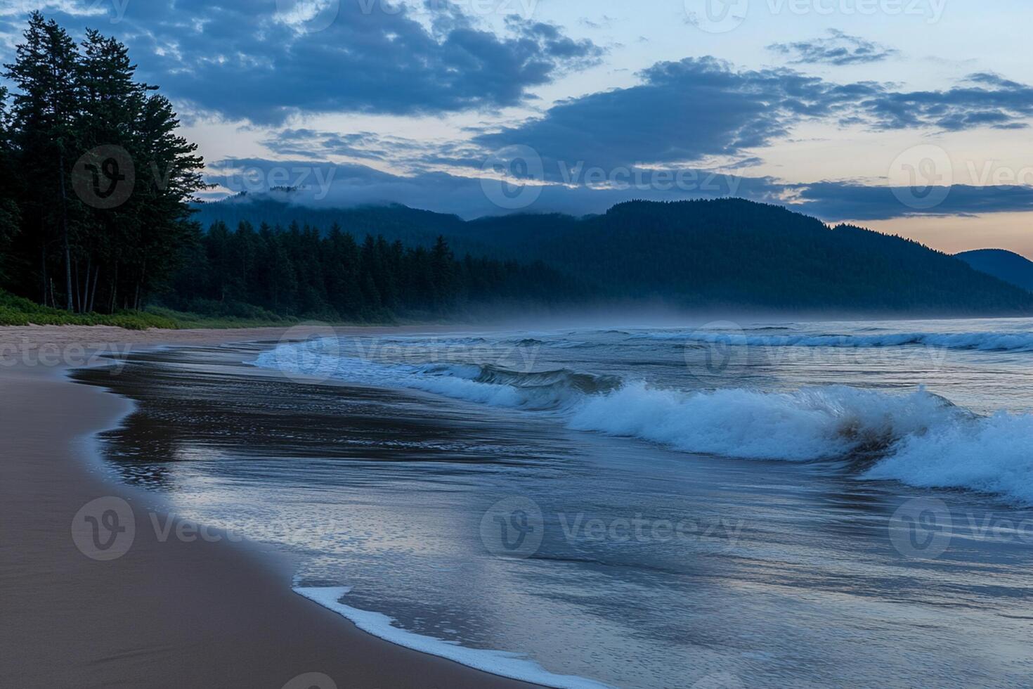 A beach with waves and a mountain in the background photo