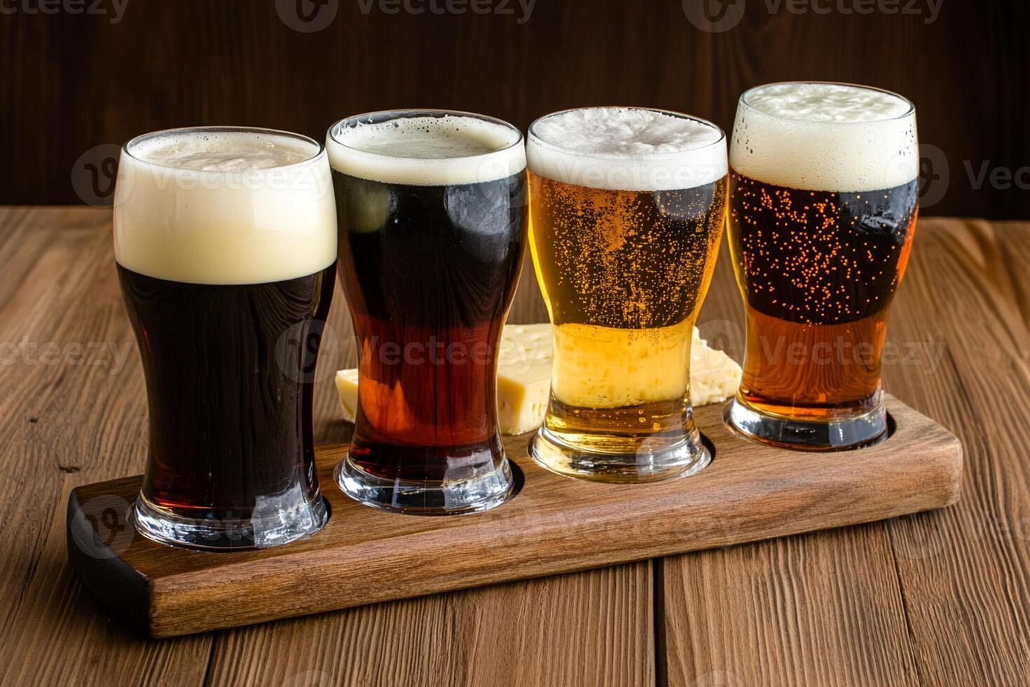 A group of four different types of beer on a wooden tray photo