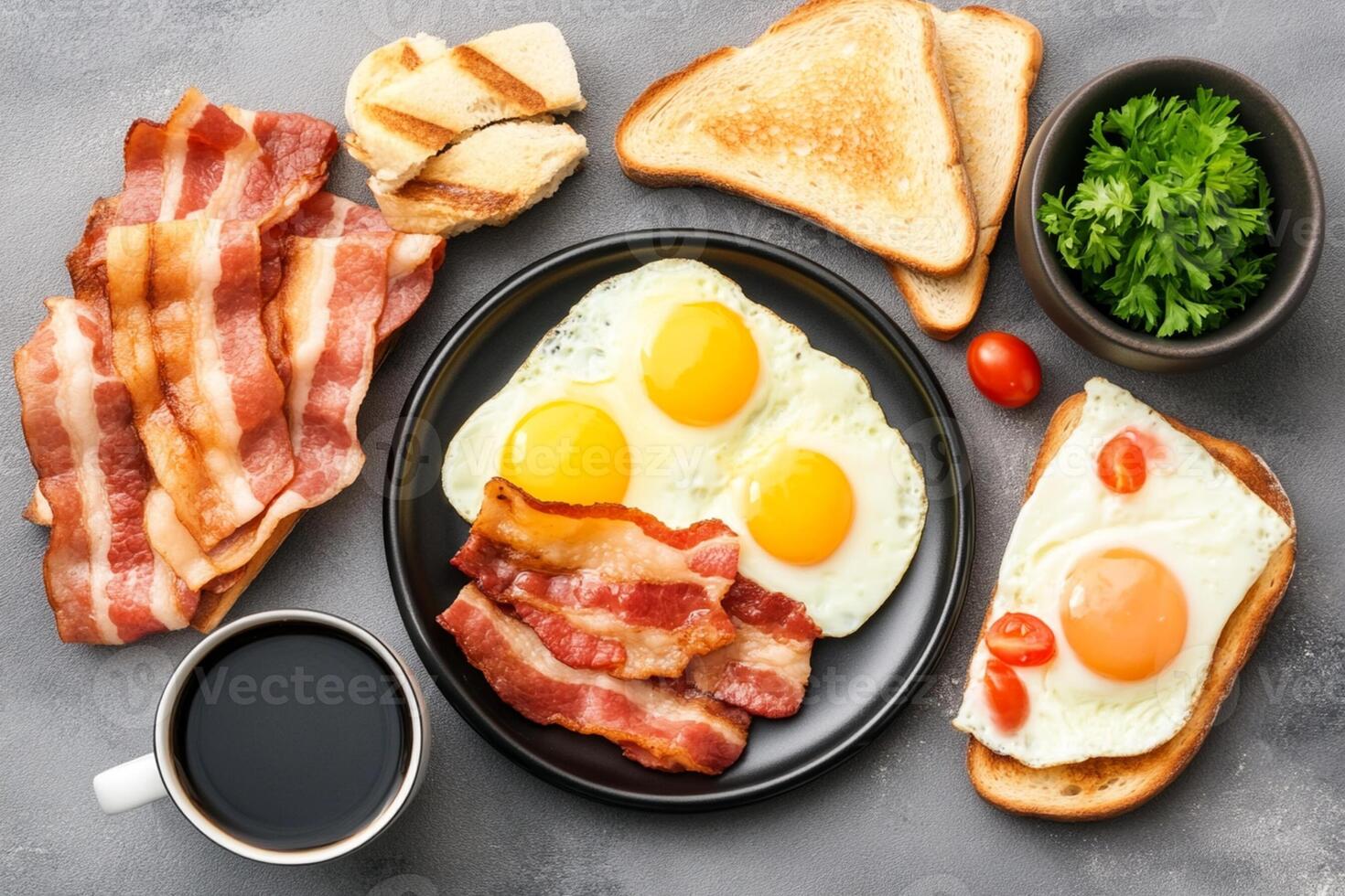 Breakfast with eggs, bacon, bread and coffee on a gray background photo