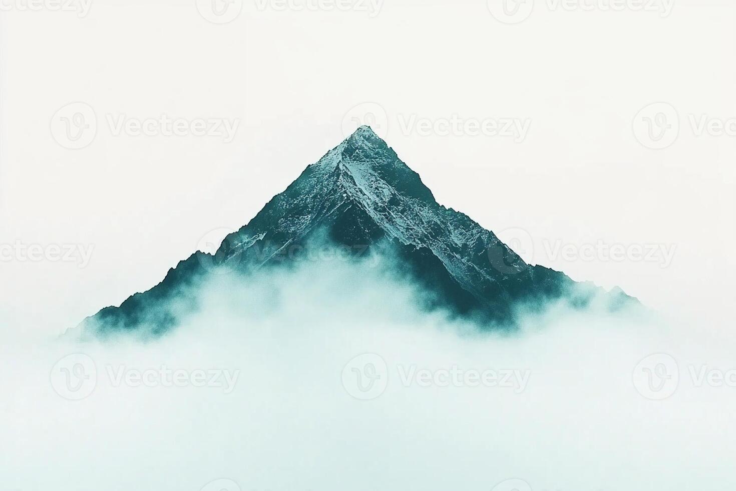 A mountain is covered in fog and clouds photo