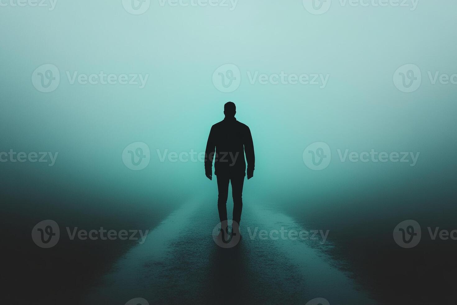 Man standing alone in the fog photo