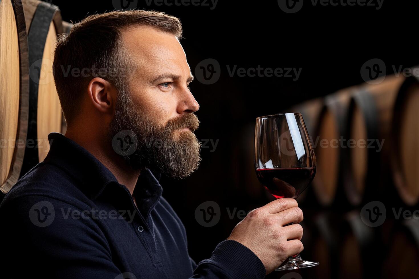 A man with a beard and a glass of wine photo