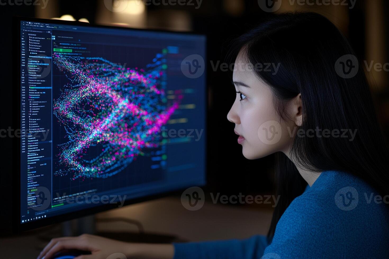 A woman is looking at a computer screen with a graph on it photo