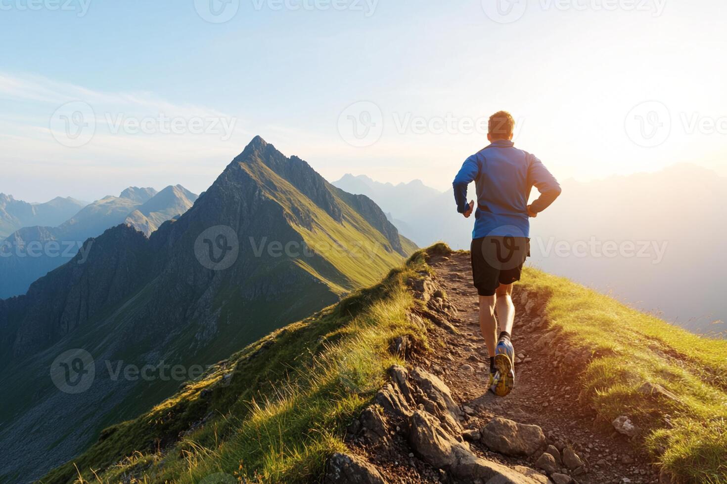 A man running on a mountain trail photo