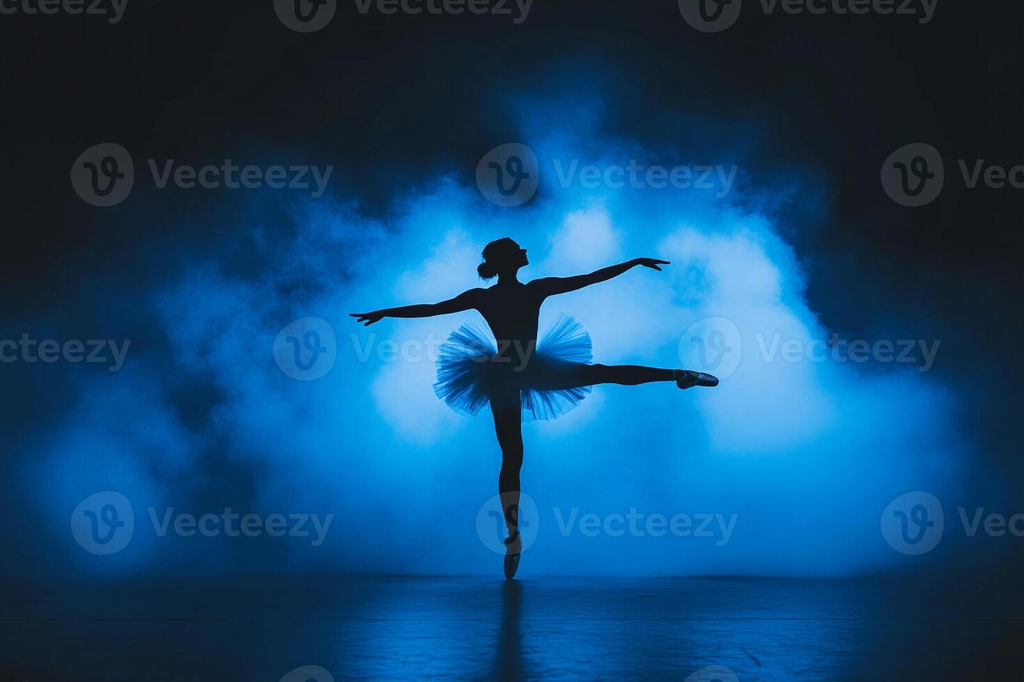 A silhouette of a ballerina in a blue smoke photo