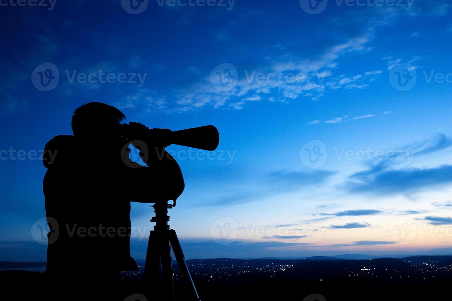 A silhouette of a man taking a photo with a camera