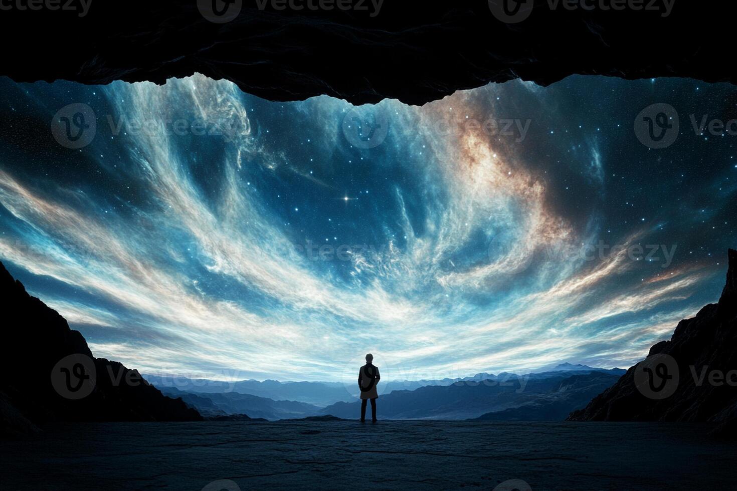 A man standing in front of a cave with a starry sky photo