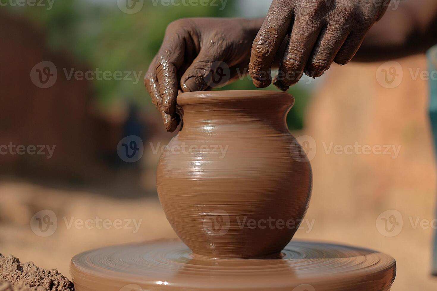 A person is making a pot out of clay photo